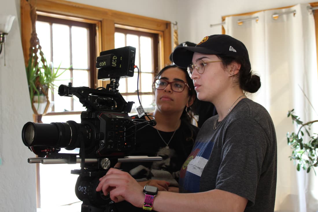 Lauren Baiza on set with the camera team
